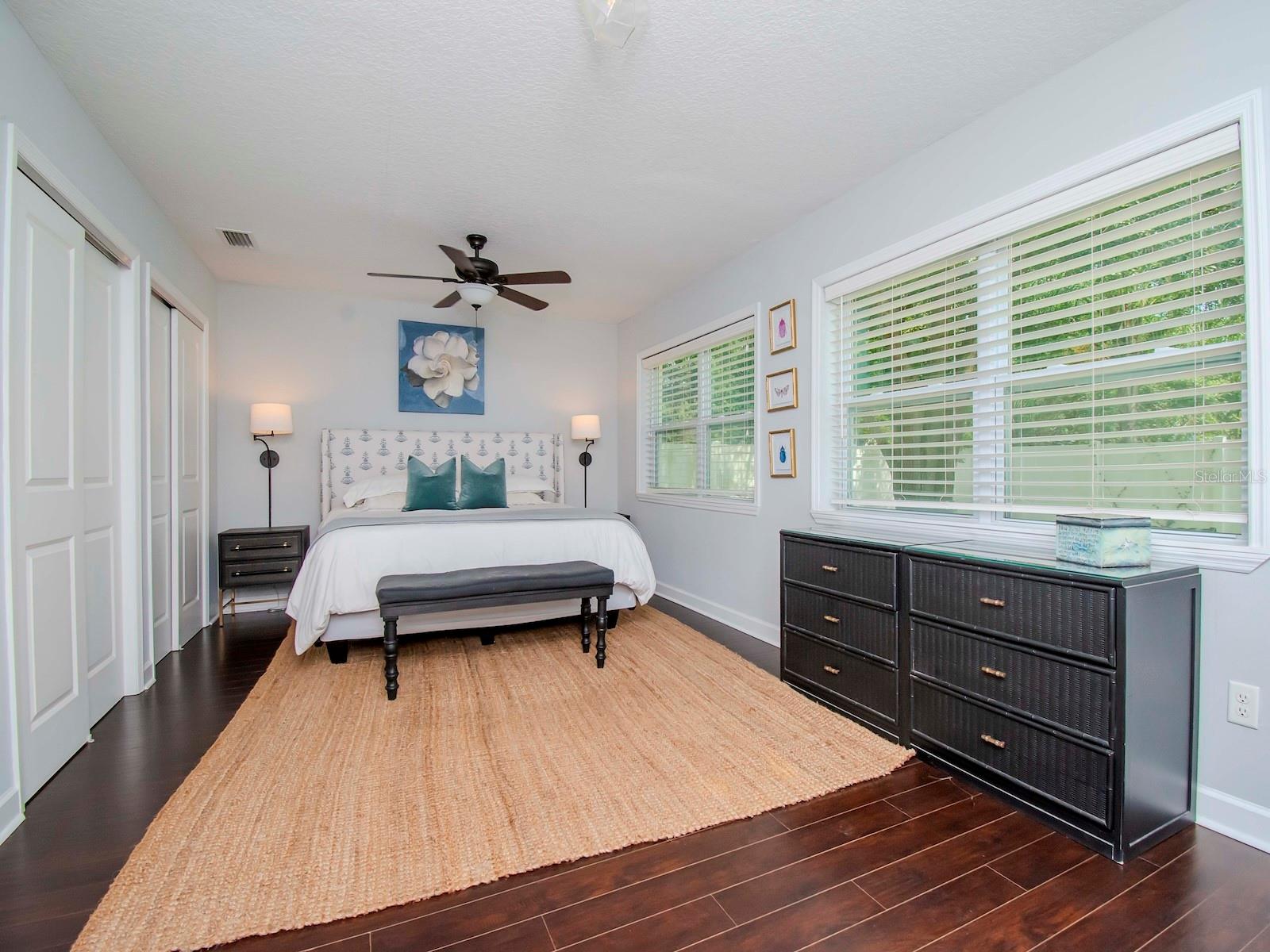 Spacious primary bedroom overlooking the large backyard.