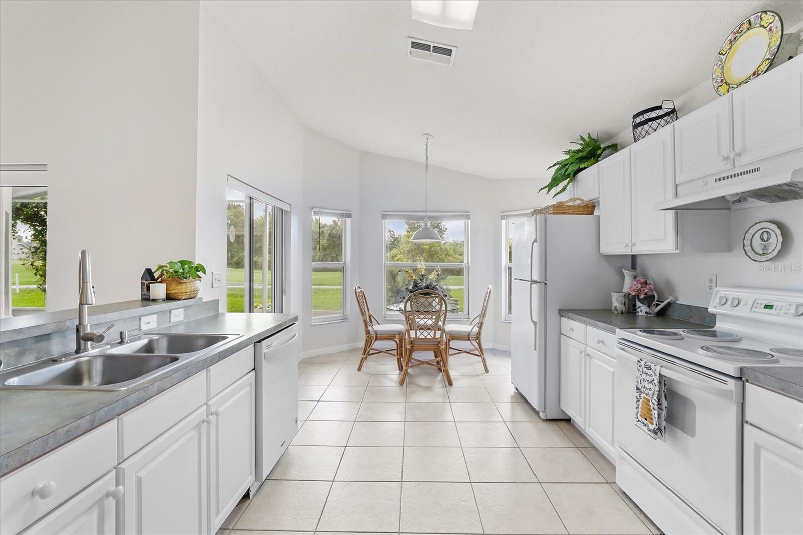 Spacious eat in area in kitchen with sliding doors to patio