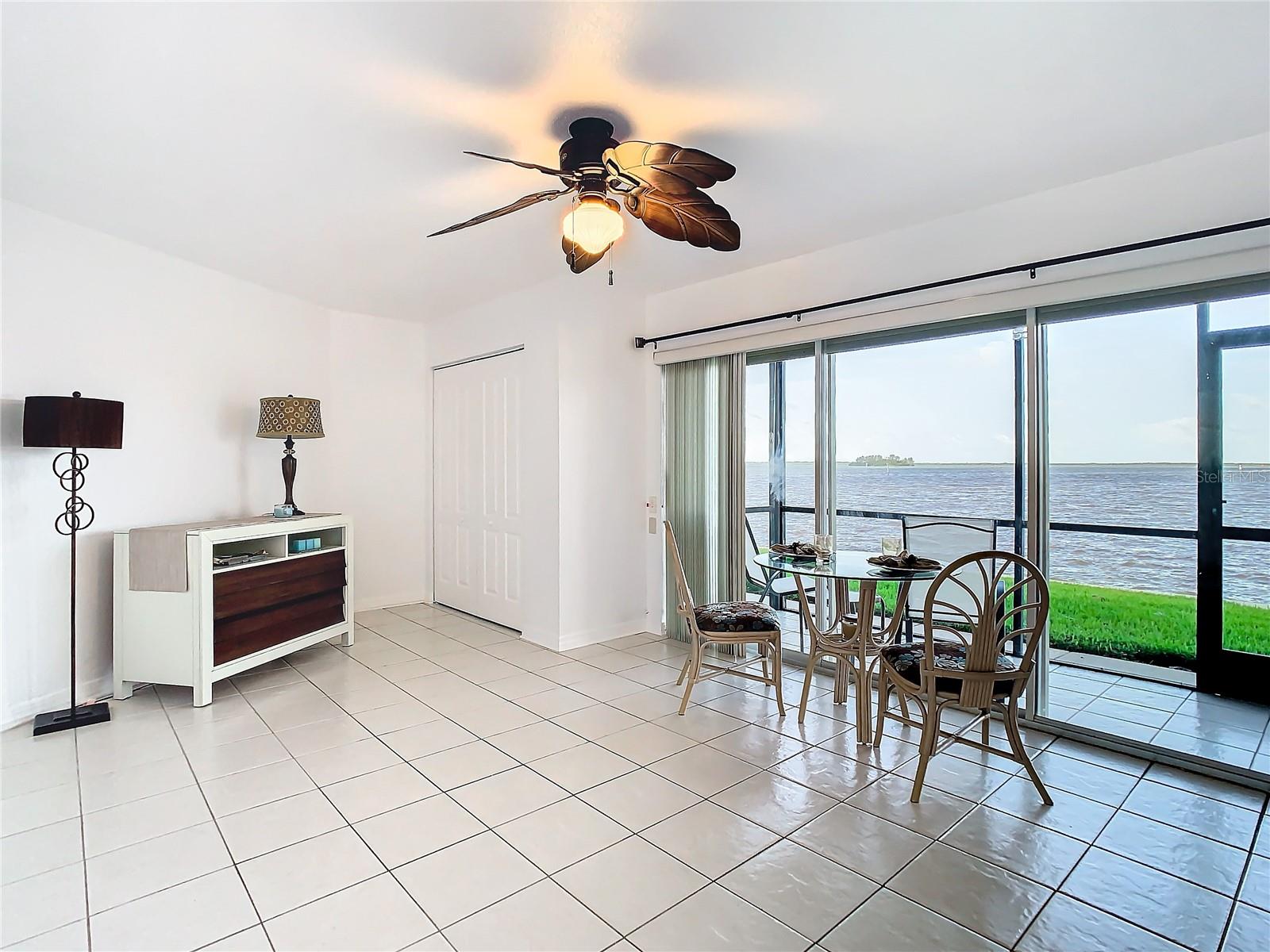 Your back is to the kitchenette, view into the great room. Check out the water view!!! ( The waters were churned up from the storm. Normally they are a brilliant blue! Straight ahead is a closet ( which can actually be removed if you wanted different space)