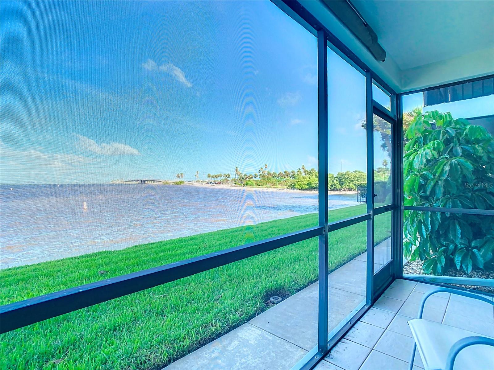 n the screened patio, view towards the north. There is a beach in this picture:-)