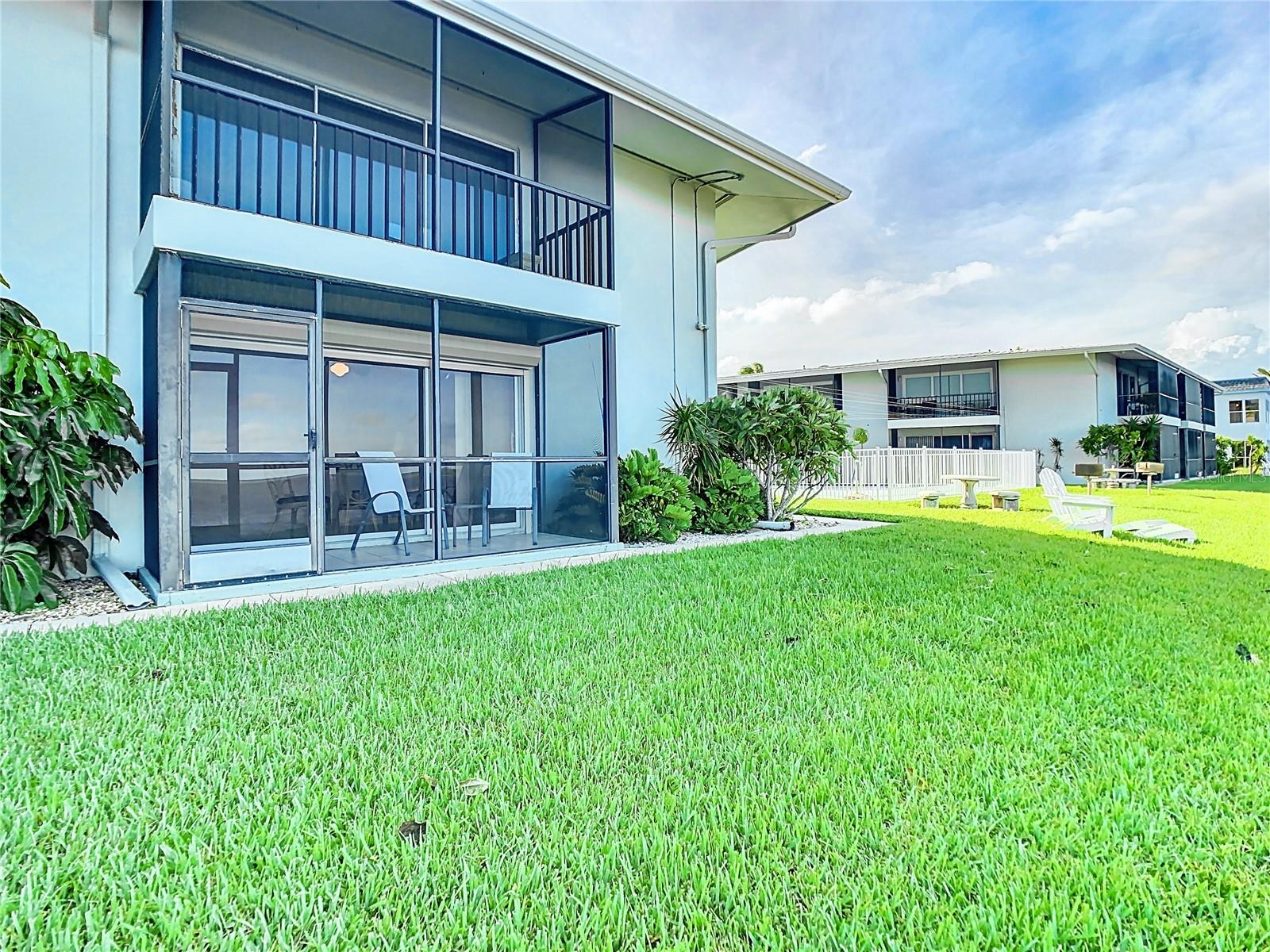 View of the studio, 1st floor. Your back is to the water. The white fencing is where the community pool is located.