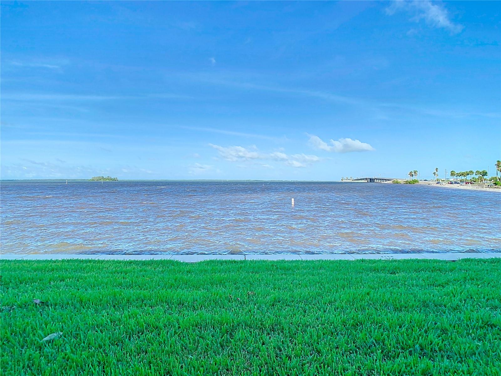 View due west from just outside the screened patio. beach to the right.