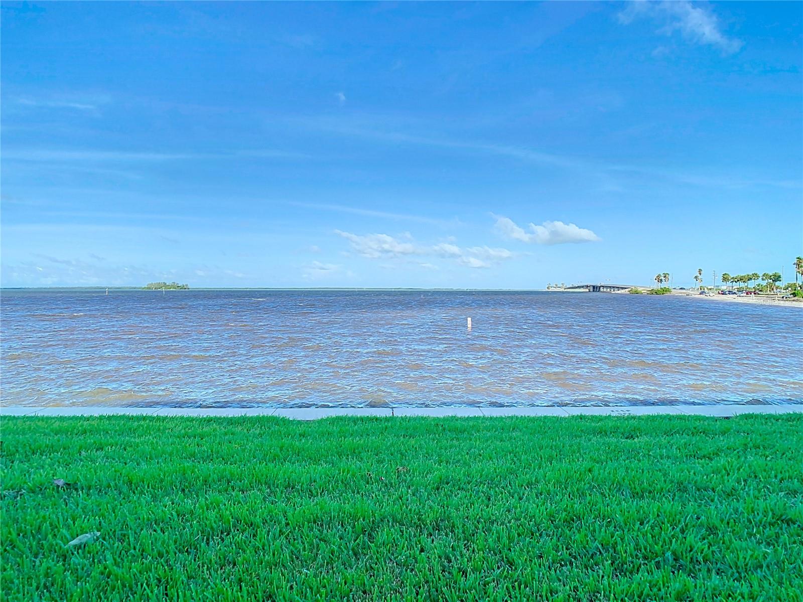 View due west from just outside the screened patio. Beach to the right.