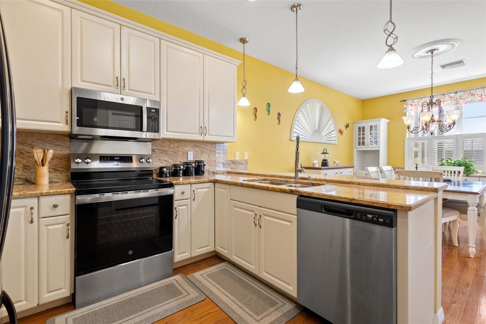 Beautiful updated kitchen with 42" cabinets, granite countertops and black stainless appliances