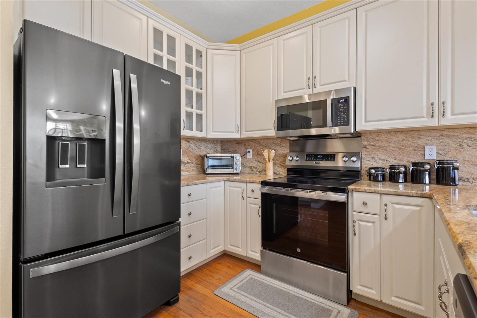 Beautiful updated kitchen with 42" cabinets, granite countertops and black stainless appliances