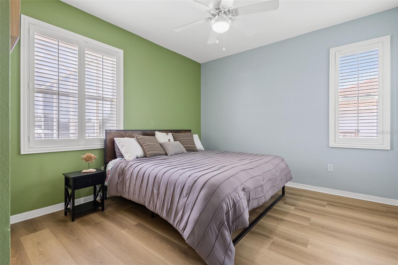 Bedroom #2 with new luxury vinyl waterproof planks and oversized walk in closets