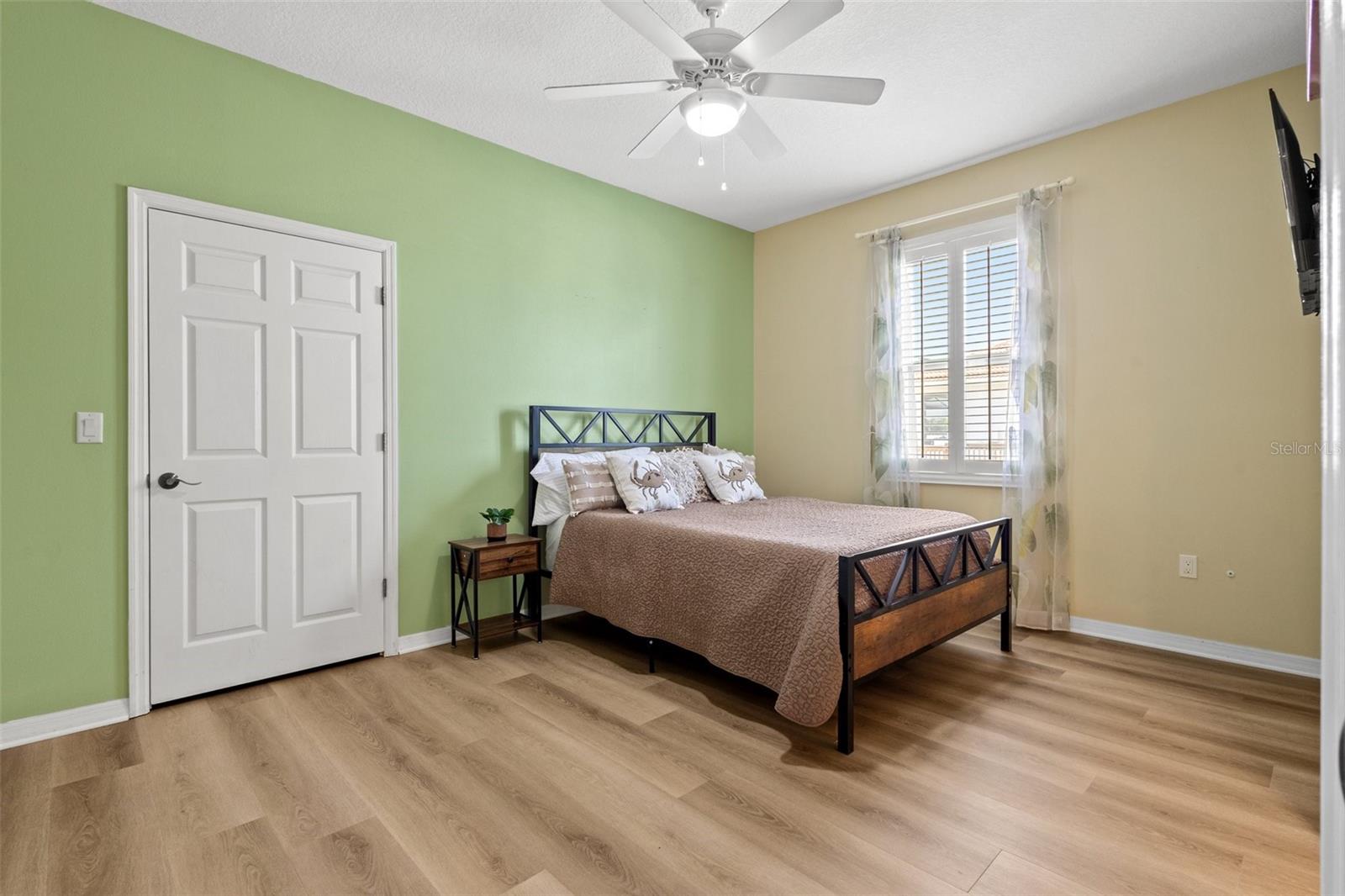 Bedroom #3 with new luxury vinyl waterproof planks and oversized walk-in closets