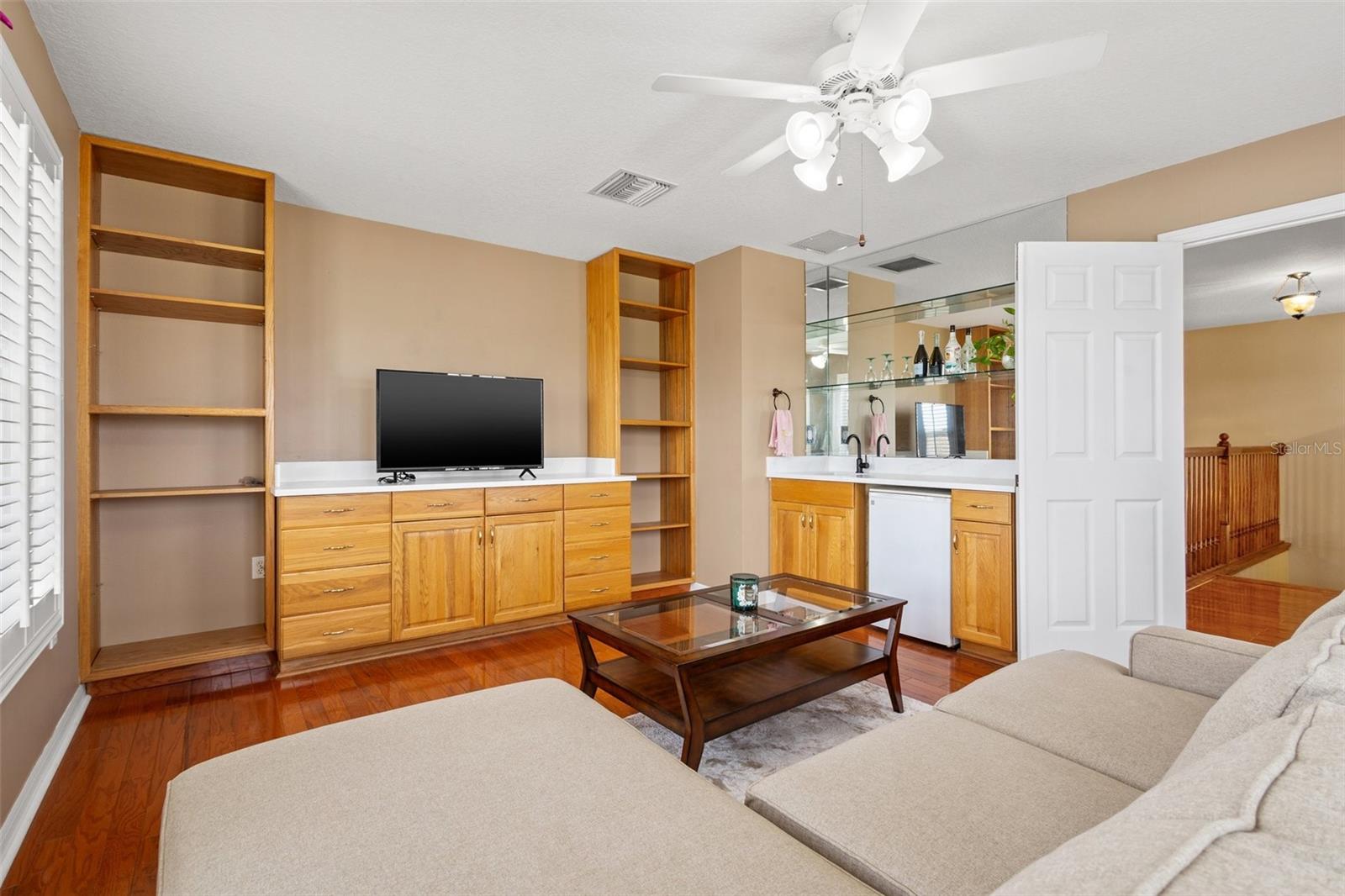 Upstairs bonus room with a wet bar