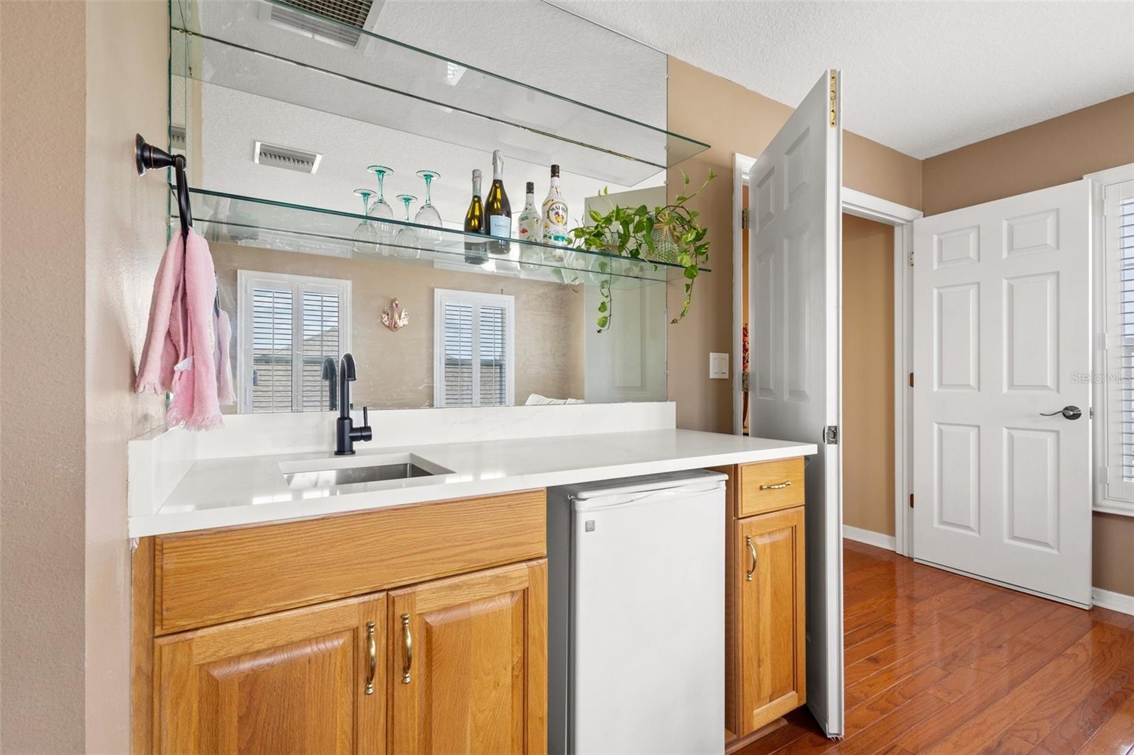 Upstairs bonus room with a wet bar