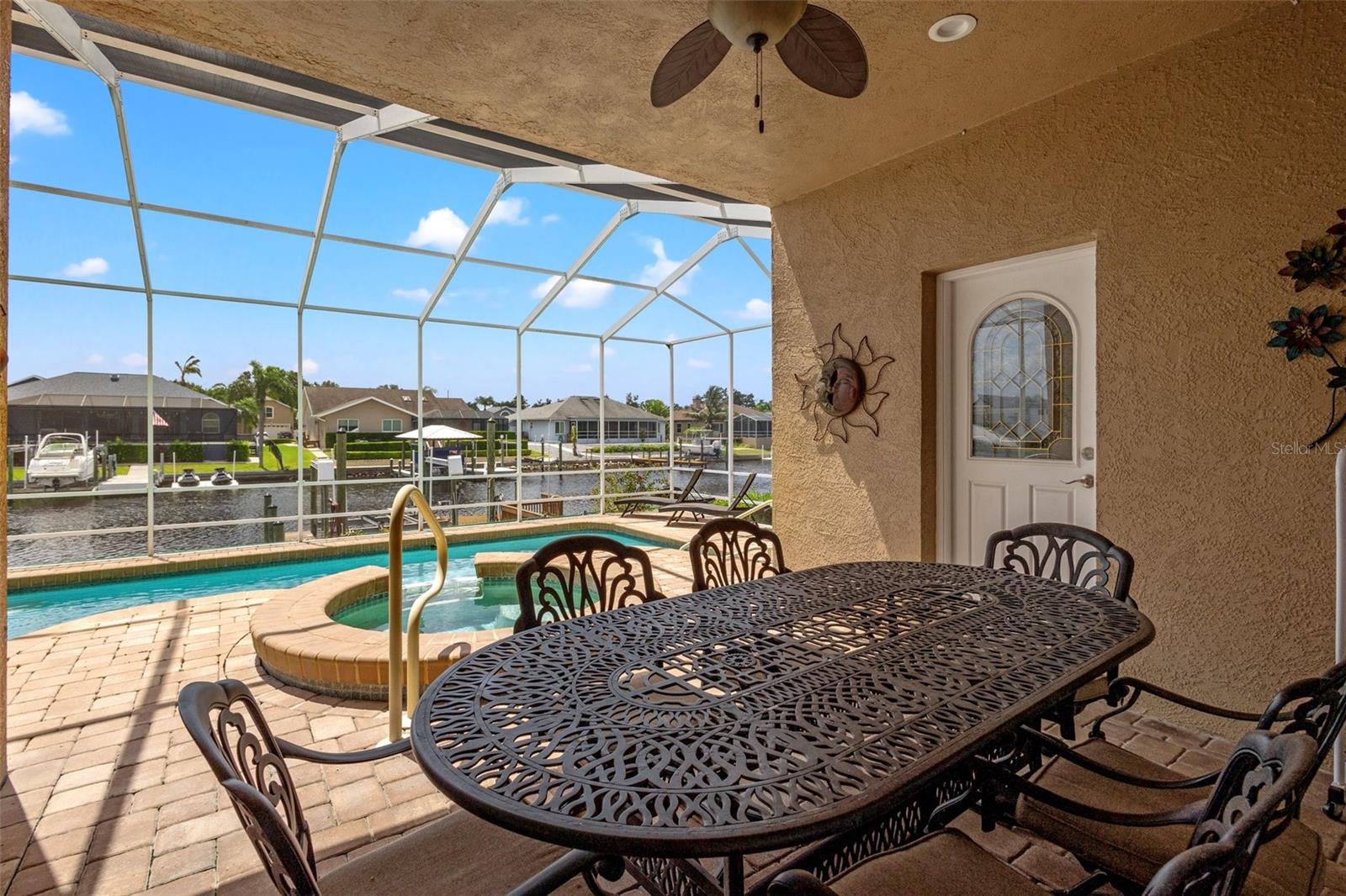 Beautiful pavers line the lanai for gorgeous views of the pebble tech pool and water