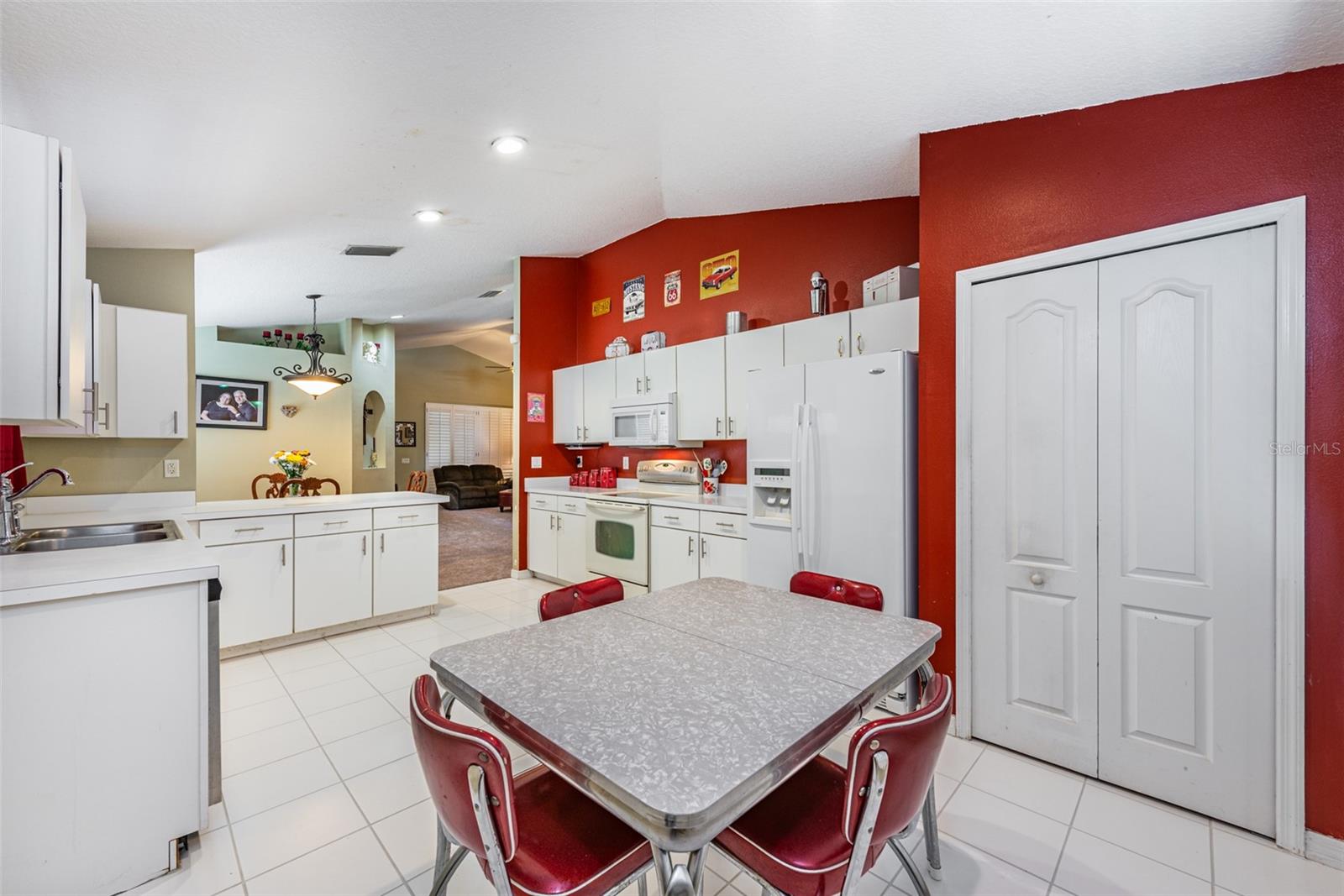 There is room for a casual dining table and loads of counter space for meal prep, a breakfast bar and a large closet pantry for extra kitchen storage.