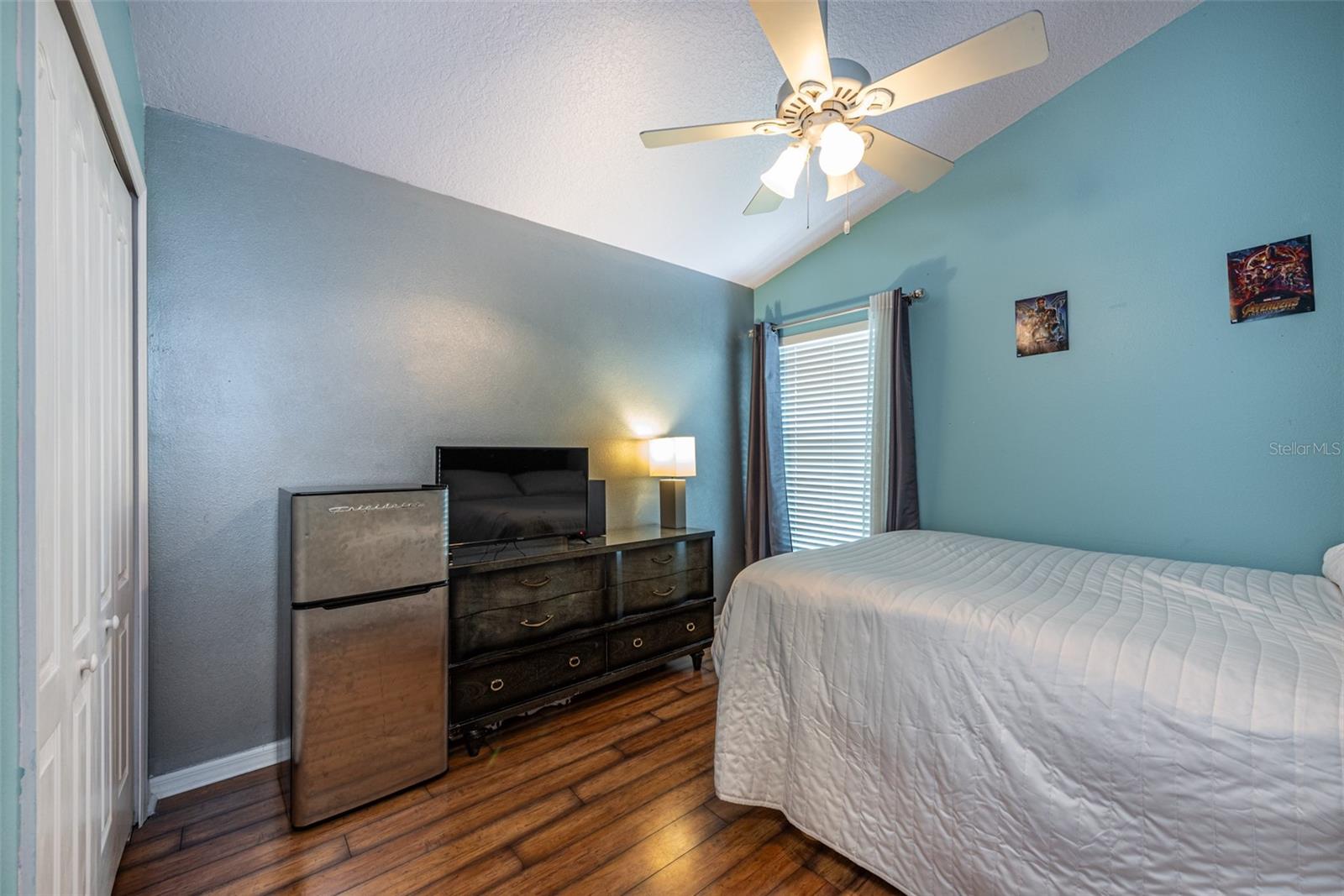 Secondary bedroom #2 is 10' X 10' with laminate flooring and a cathedral ceiling with fan.