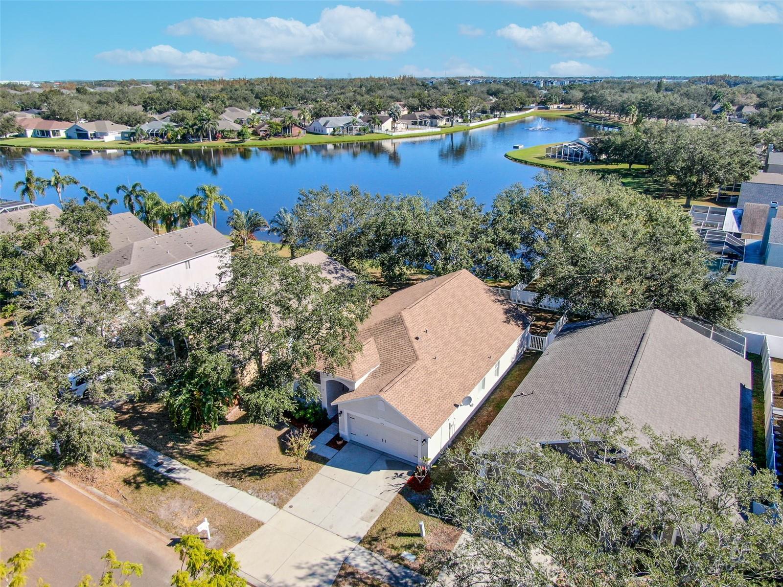 Aerial view of the lake in Pavilion Community in the rear of this charming home.