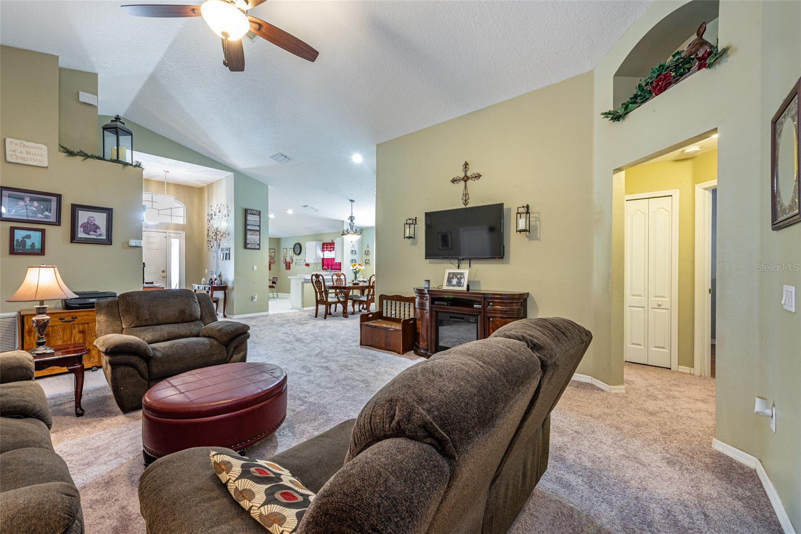 Open floor plan blends the family room, dining room, foyer and kitchen.