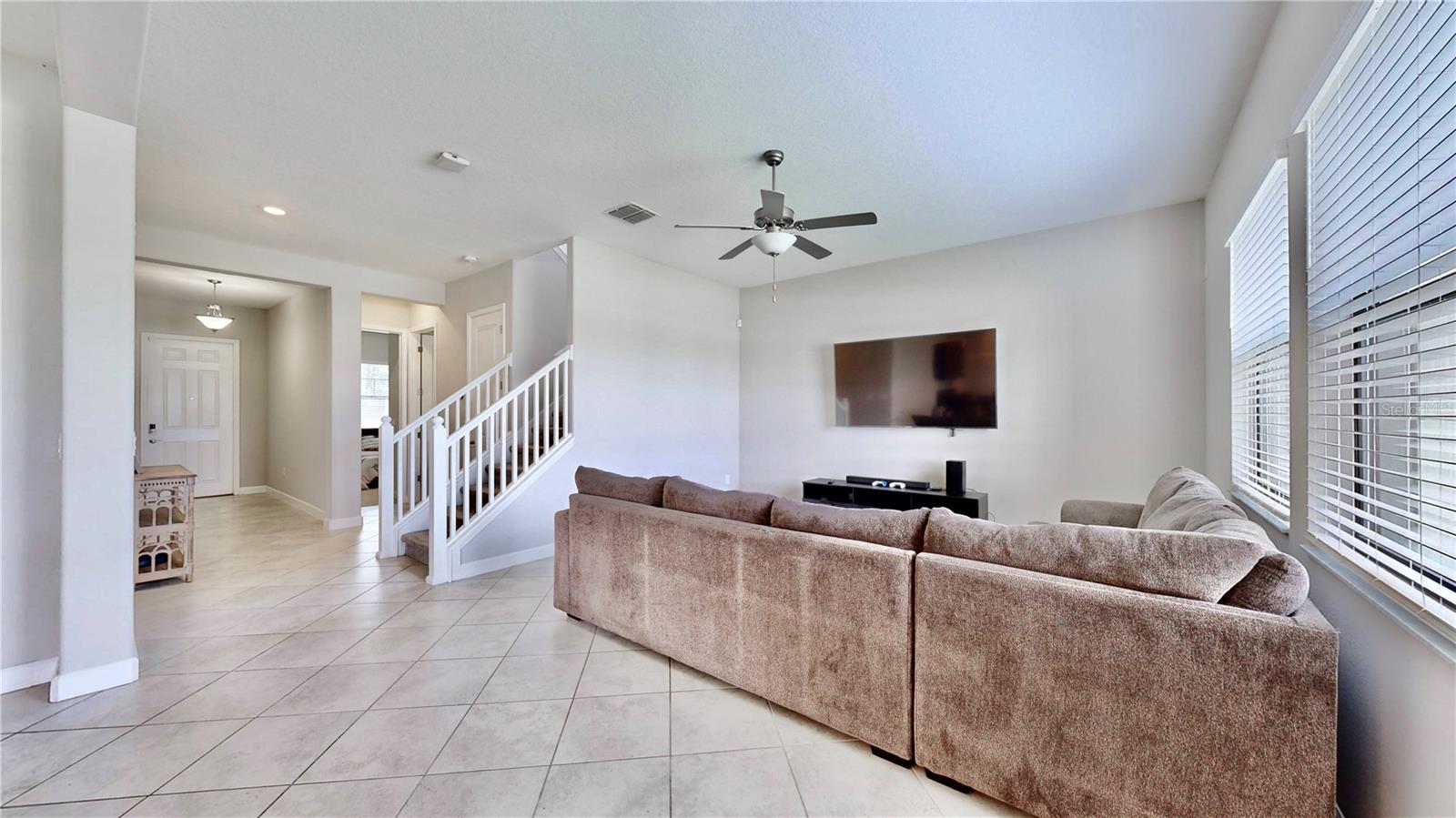 Living room looking back at entry and stairs