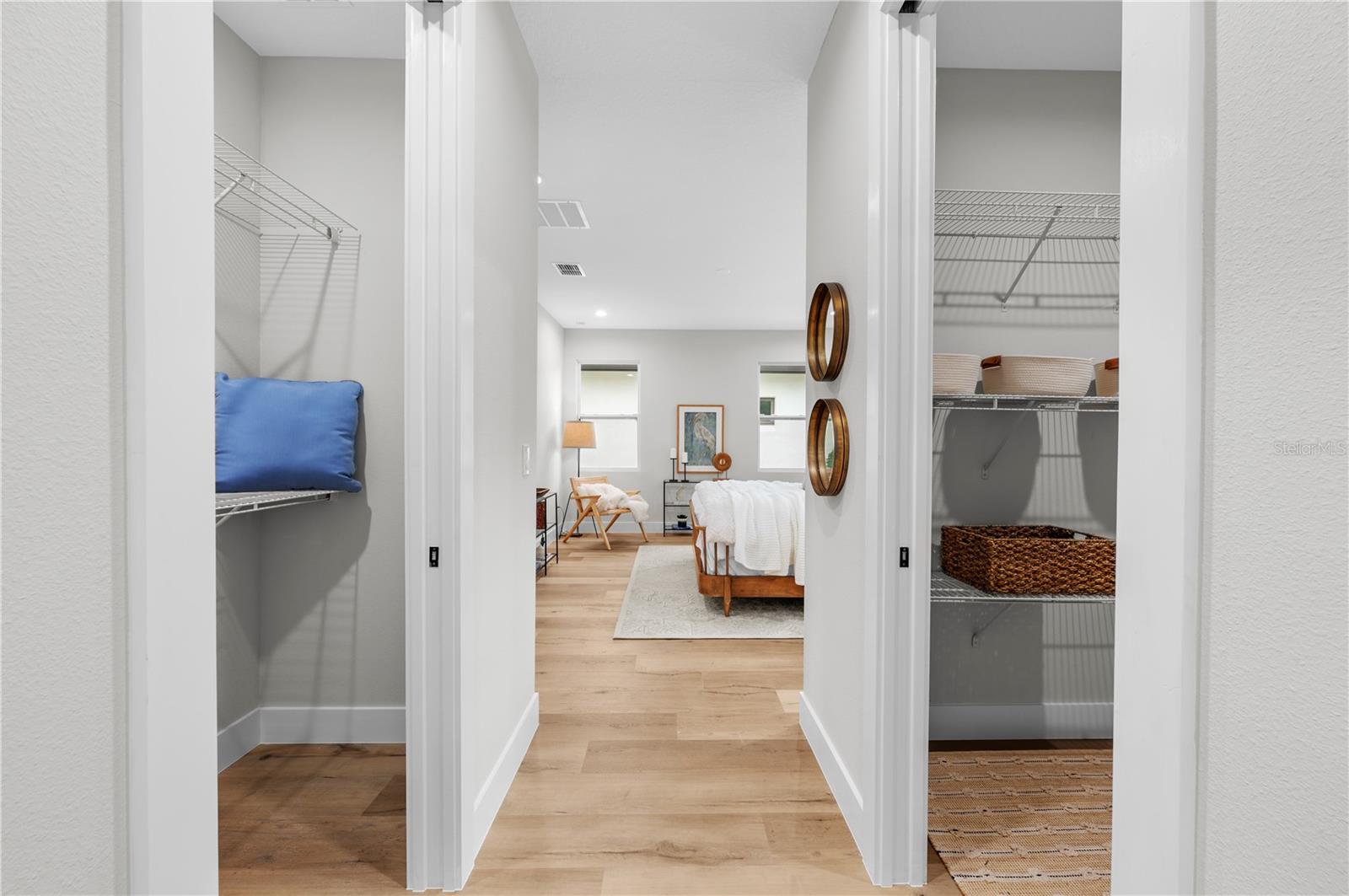 Primary bedroom features two walk-in closets