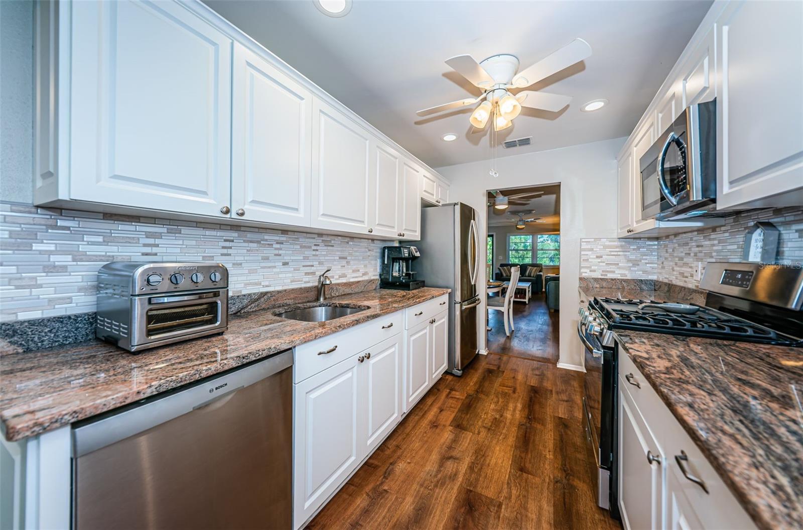 Stainless steel dishwasher, refrigerator, oven and microwave.