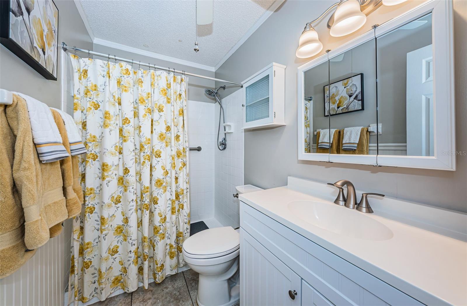 Ensuite primary bathroom with a step in shower.