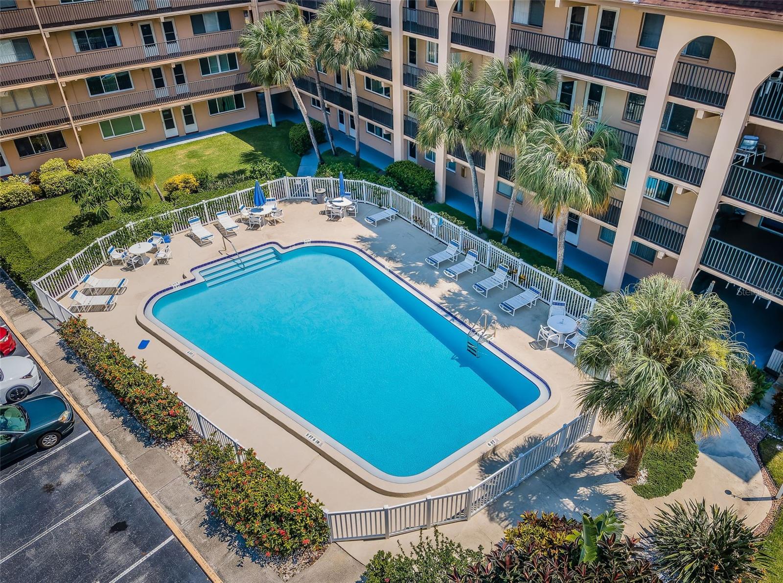 Overhead shot of the condo, highlighting the swimming pool area as a relaxing retreat within the community.