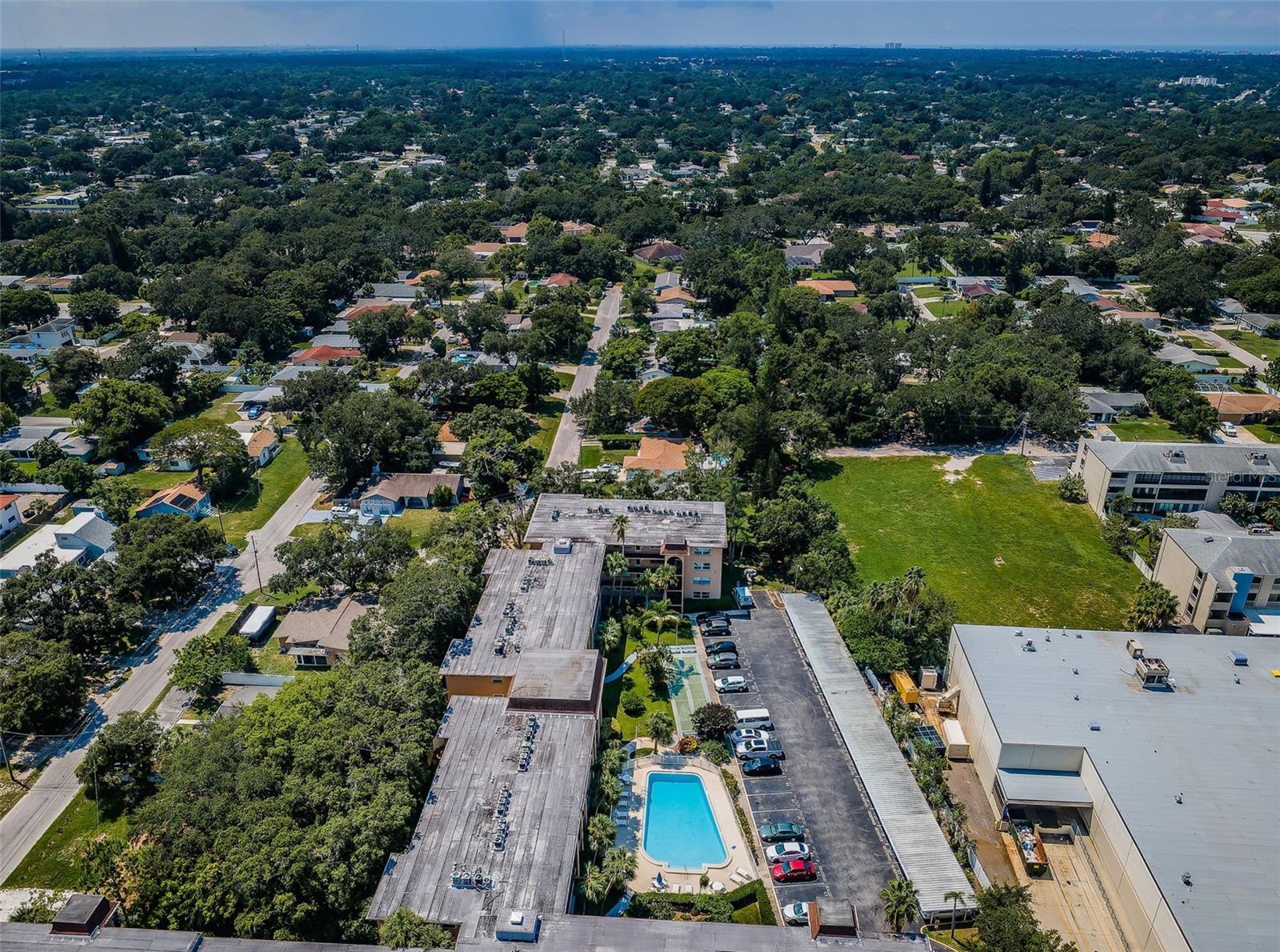 A bird’s-eye view of the condo, providing a comprehensive look at the building’s design and its placement within the surrounding landscape.