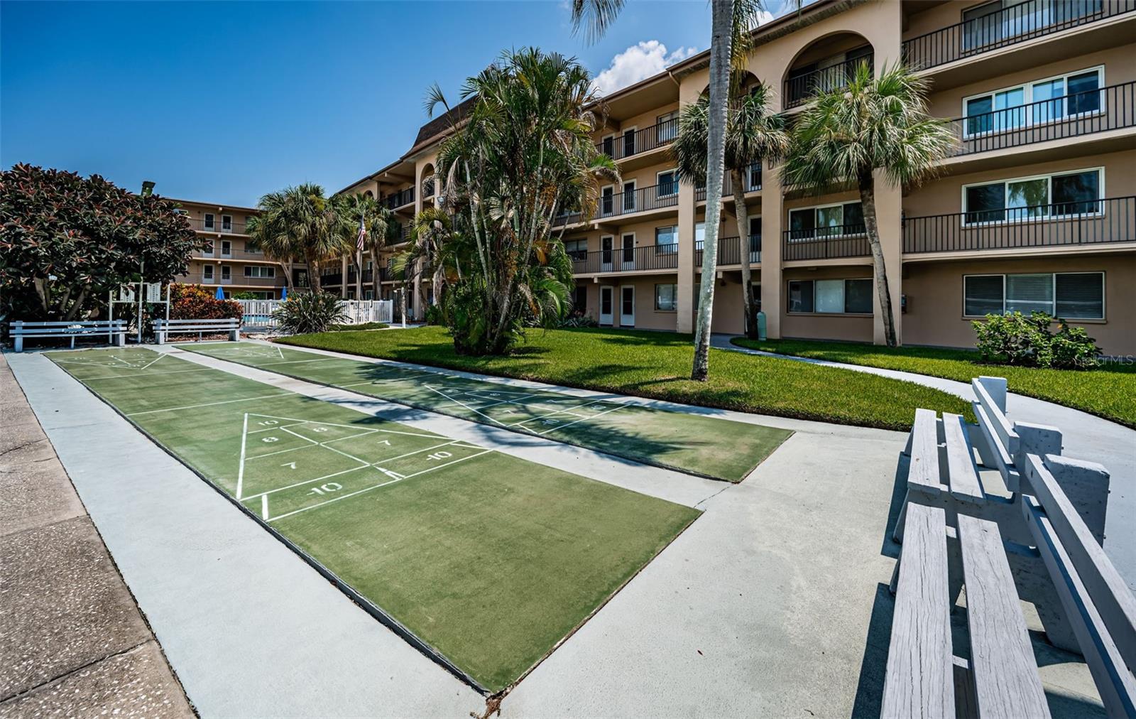 A well-maintained shuffleboard court, offering a fun and relaxing outdoor activity for condo residents.