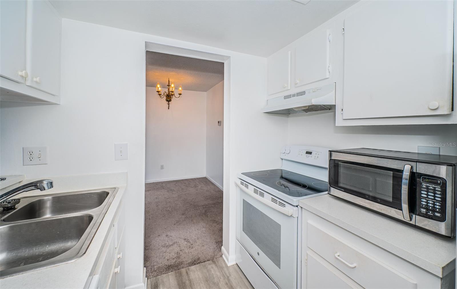 The countertops offer room for cooking, and the cabinetry provides storage to keep your kitchen tidy and functional.