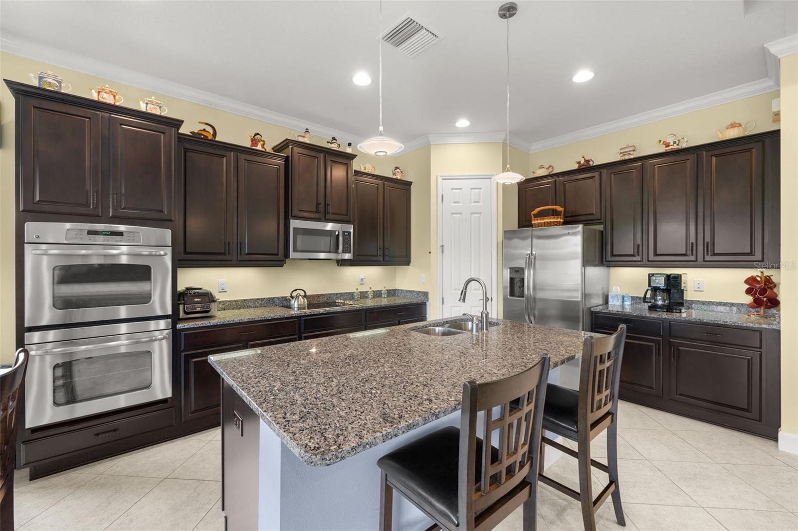 Kitchen with counter height seating and double oven