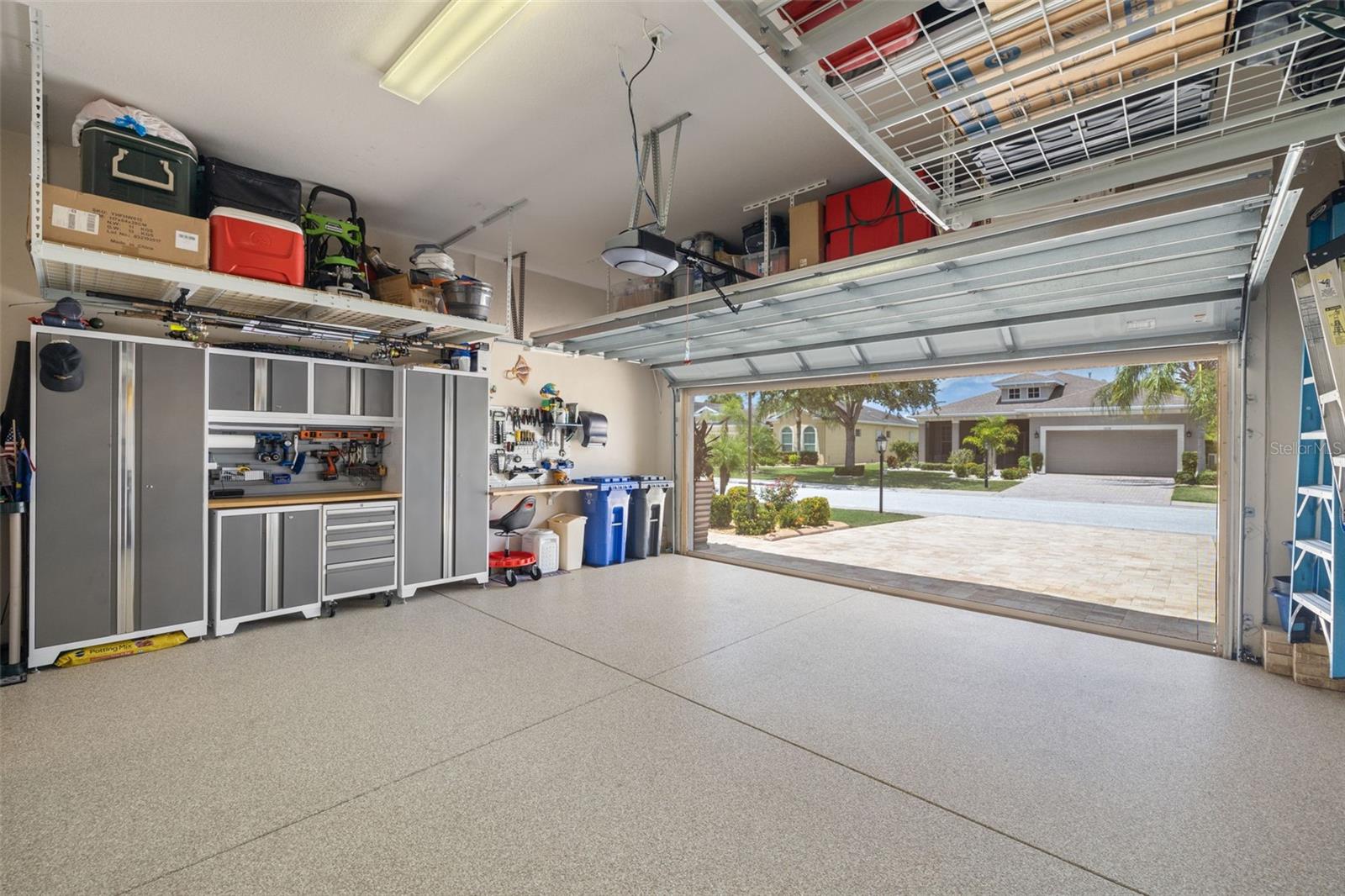 Garage with built in work space and epoxy flooring