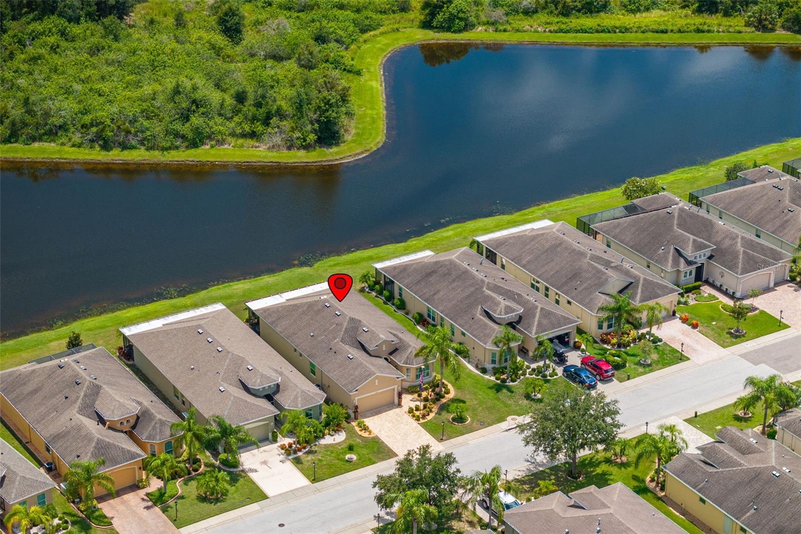 Overview of house in allotment with pond view