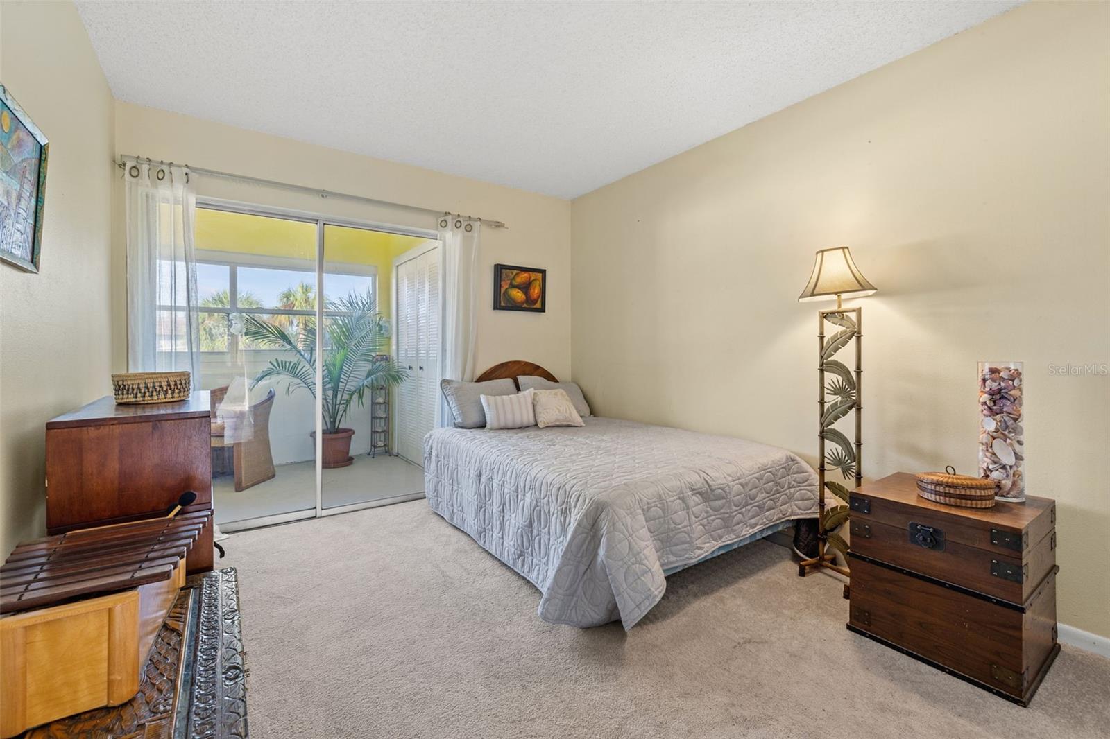 2nd Bedroom with Glass Sliding Door out to the Sunroom