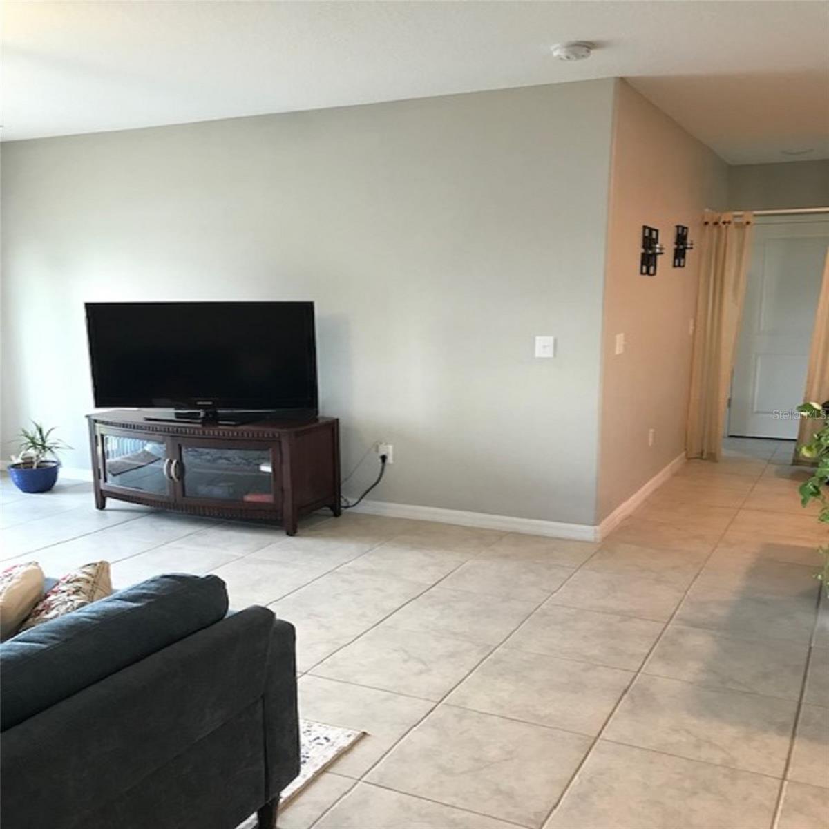 Living Room with hall way to Main Floor Bedroom