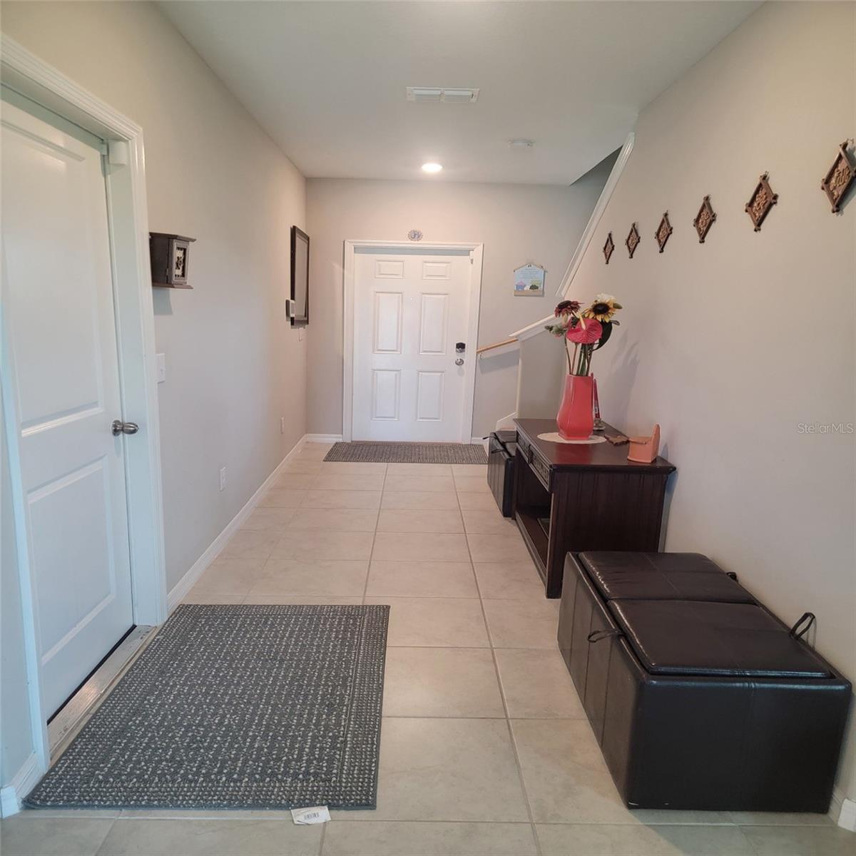 Foyer Entrance with view of entrance to Garage