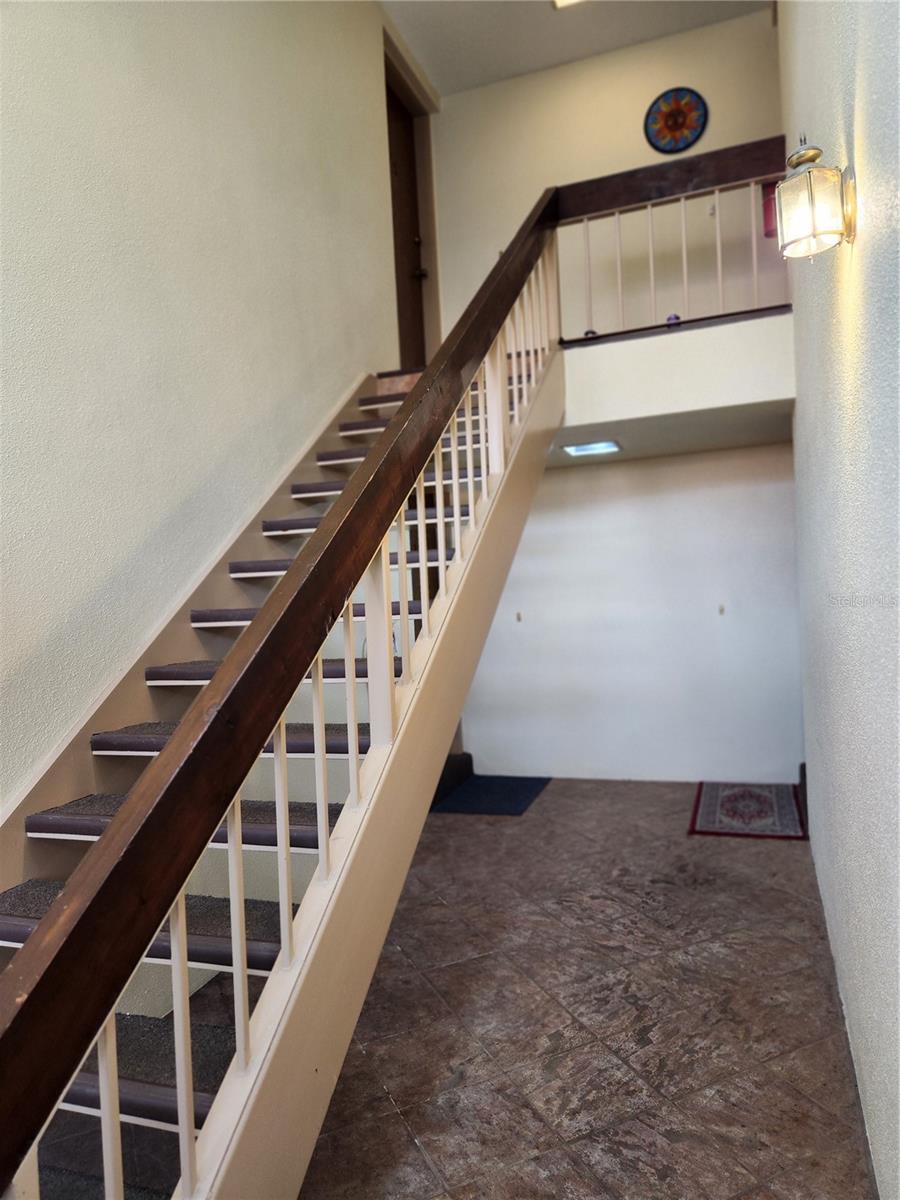 Stairs going up to unit on left