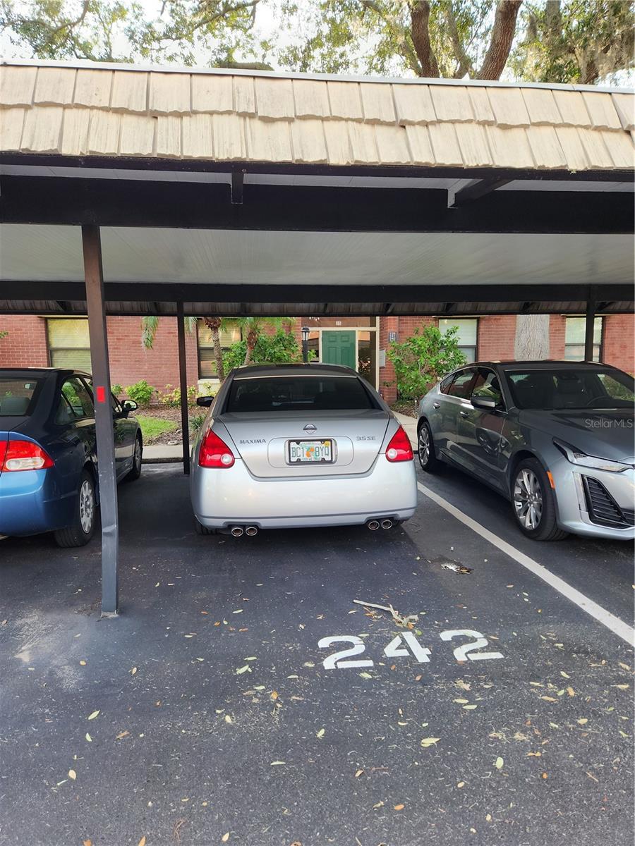 Covered parking spot comes with unit #22