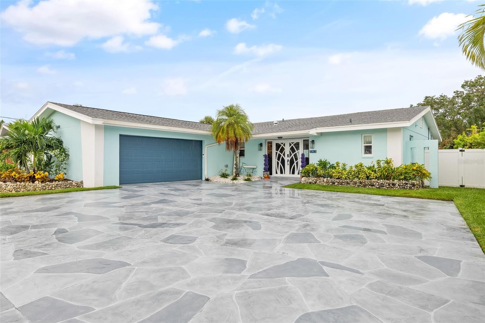 Curb appeal with an expansive beautiful driveway.