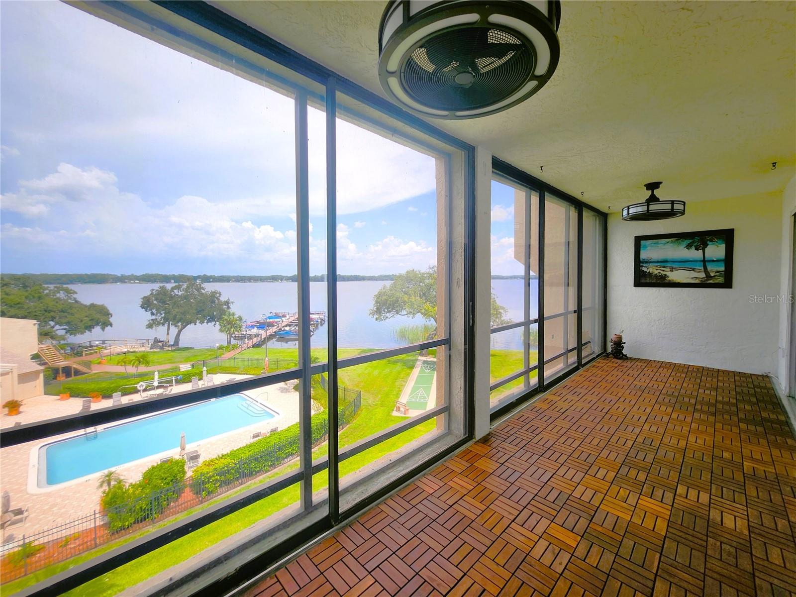 Screened Balcony/Lanai includes a storage room and 2 ceiling fans