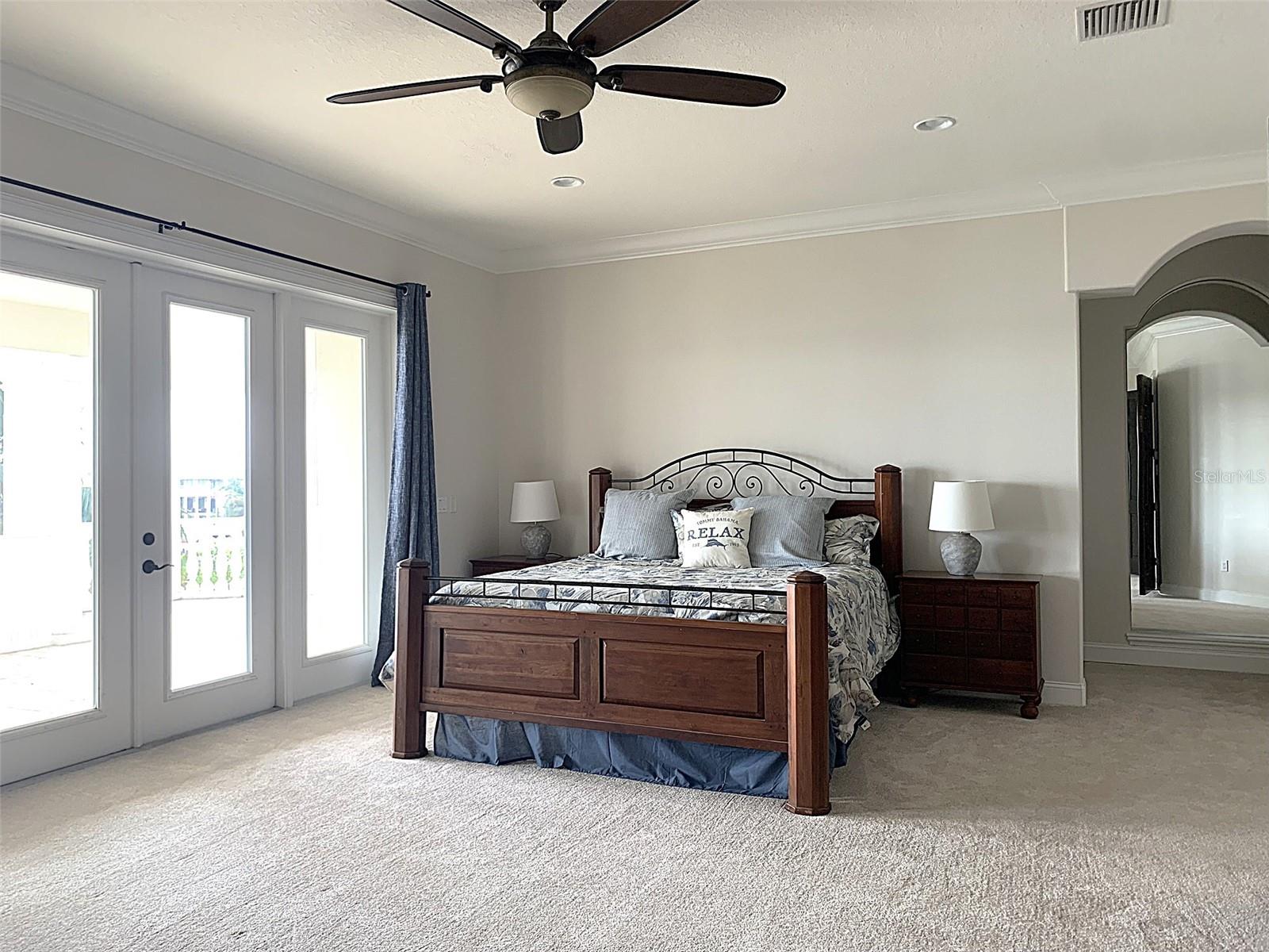 Spacious Primary Bedroom with balcony and views all the way to Tampa