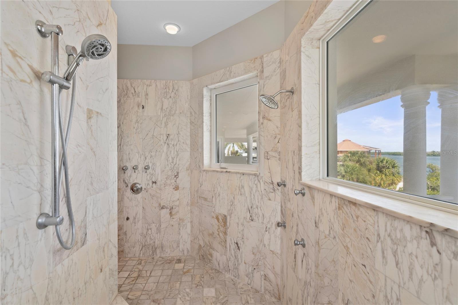 Primary Bath -Huge walk in/walk thru shower with multiple shower head options