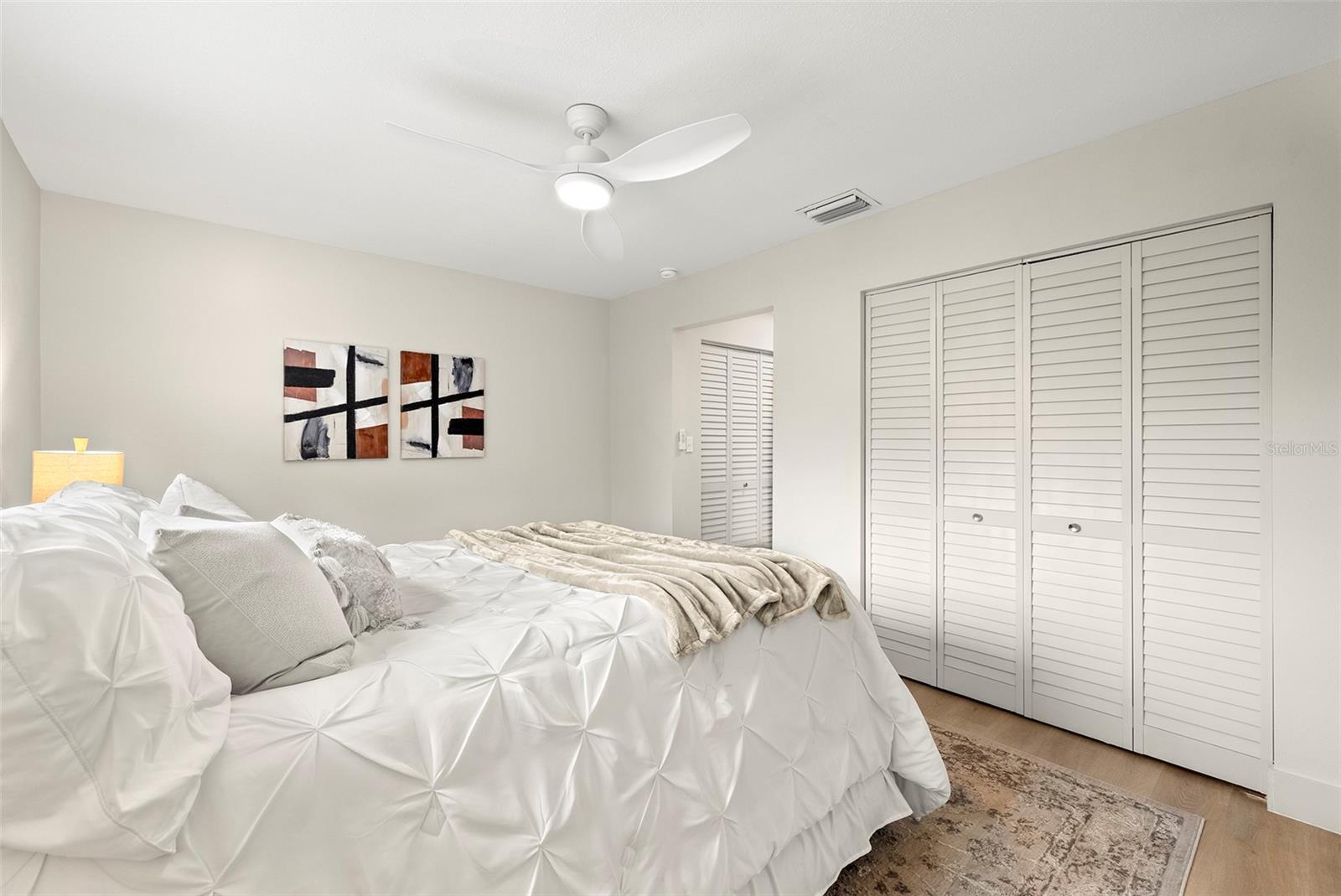 Primary bedroom with dual closets