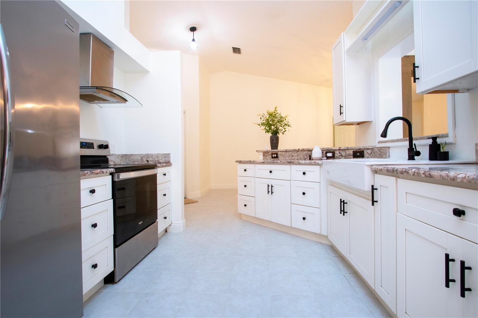 updated kitchen with granite counters and new stainless appliances