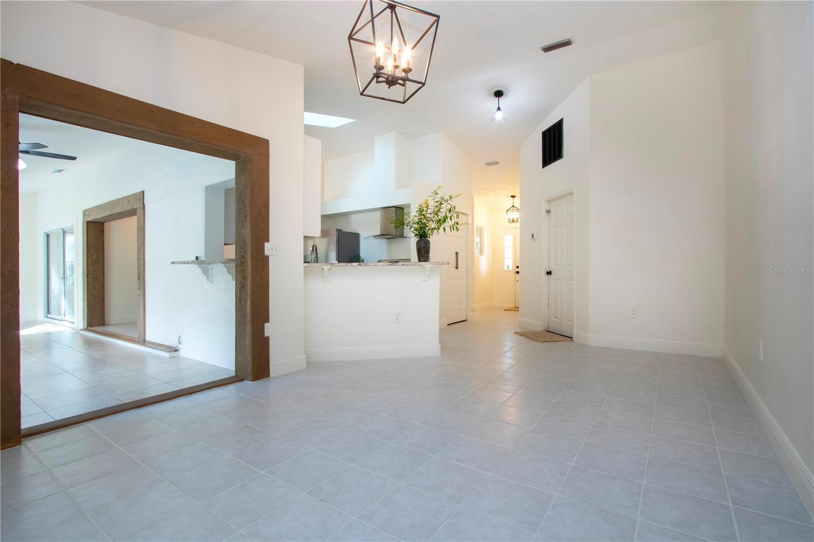 great view of the living room overlooking kitchen and Florida room