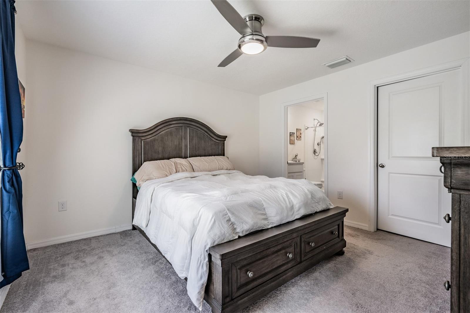 Large Master Bedroom with Ceiling fan.