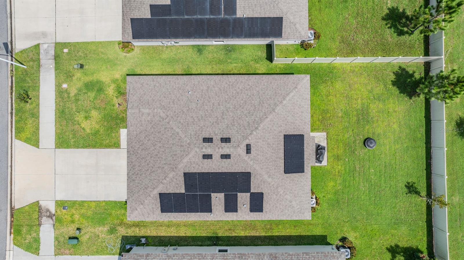 Drone overview of the home - buyers can take over the solar payments for $97/month, but they need to have their credit score checked.