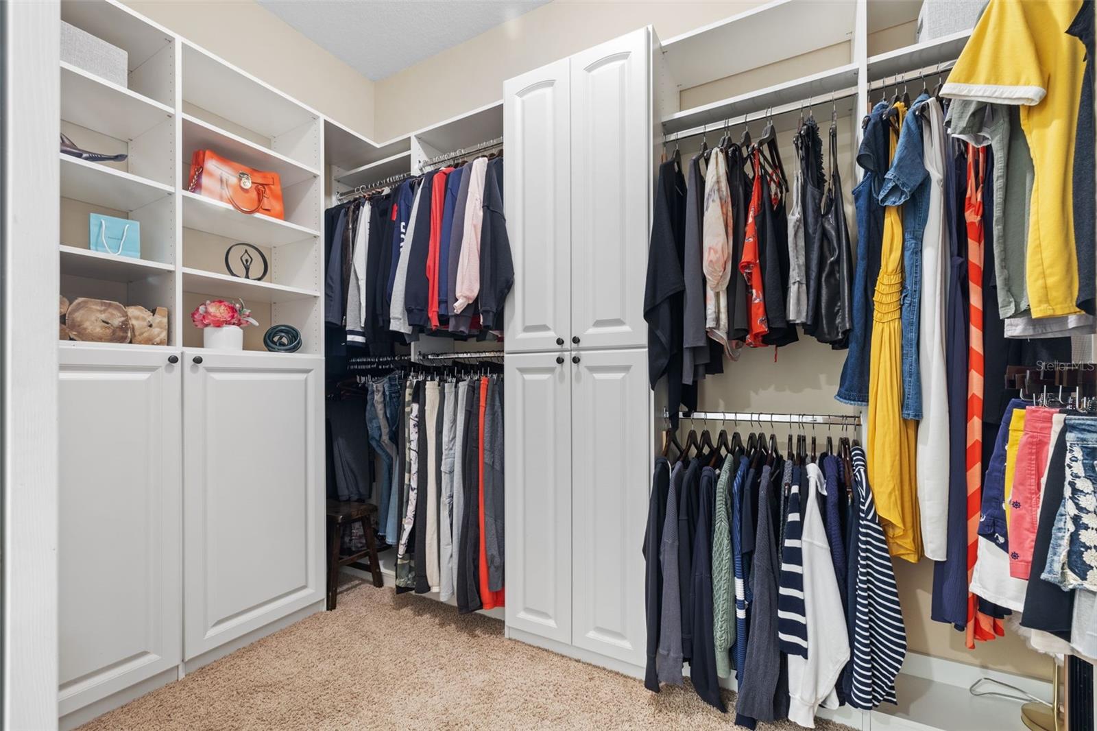 Primary Closet with built in shelves