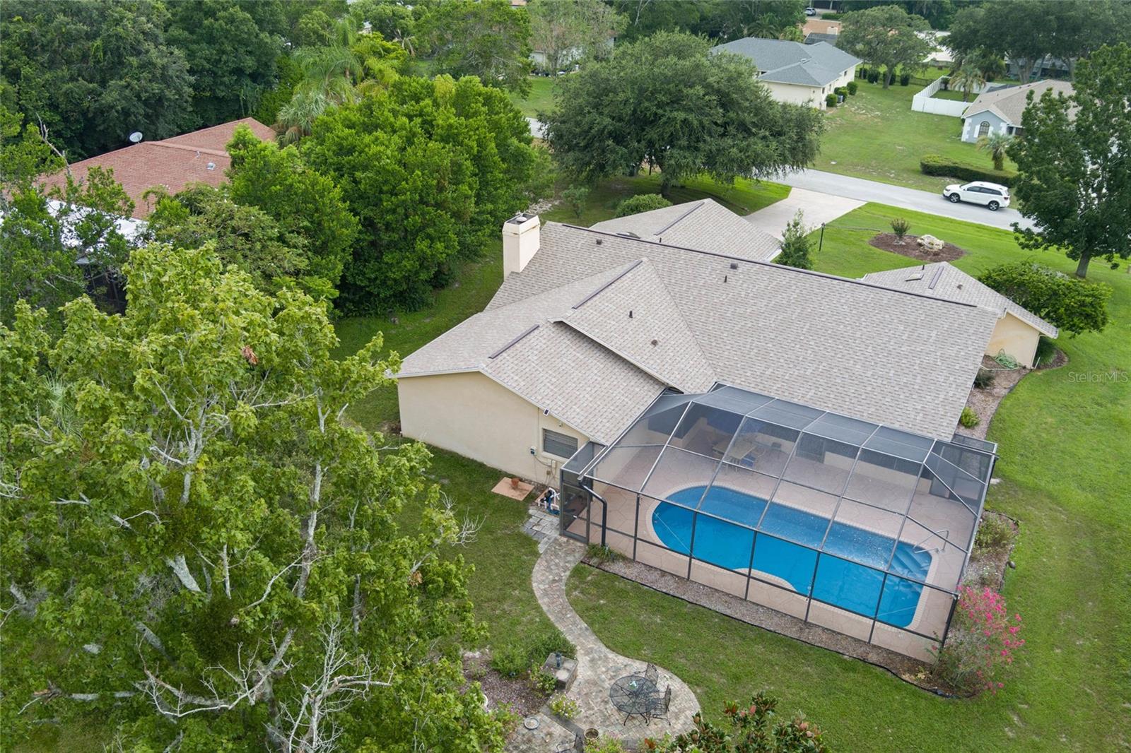 Aerial view of back of home and pool