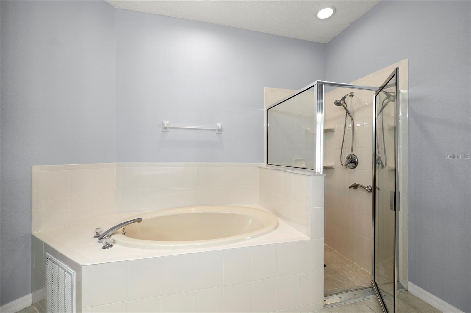 Soaking tub and shower in primary bathroom