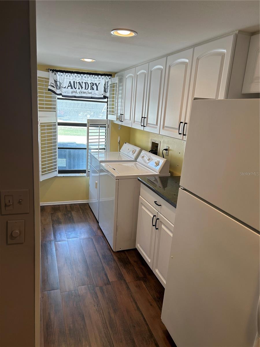 Washer/Dryer Area with Upper Cabinets