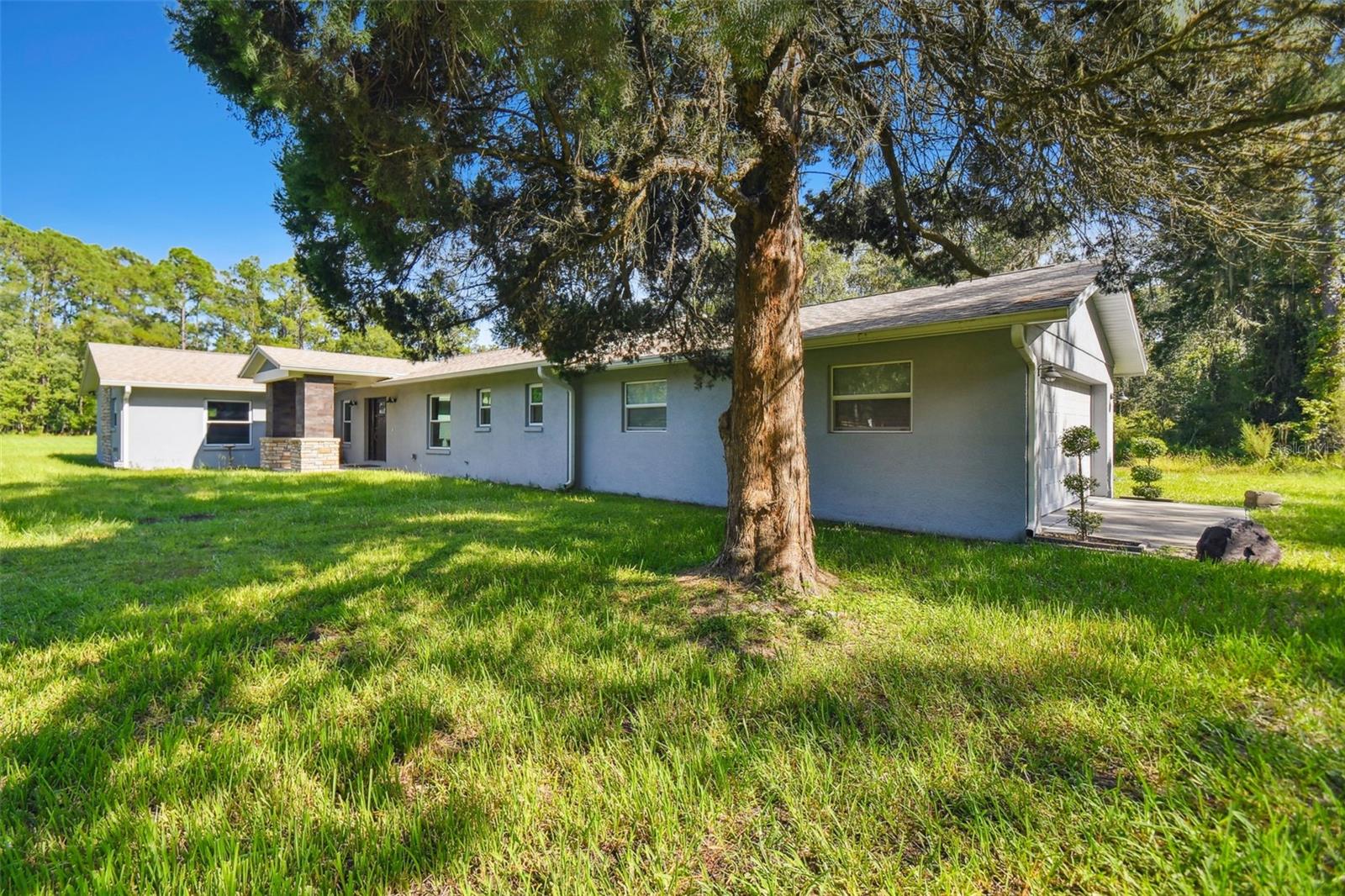 Practical AND stylish 70's ranch POOL home on 2.4 acres of pure privacy!