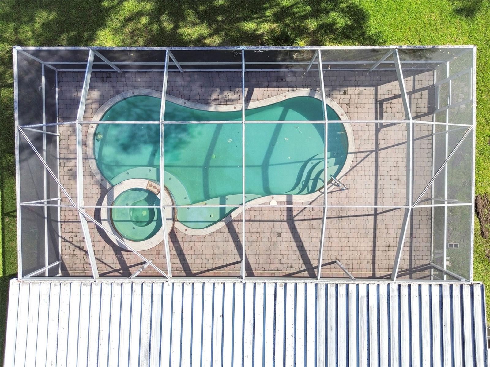 Aerial View of caged POOL, SPA and deck