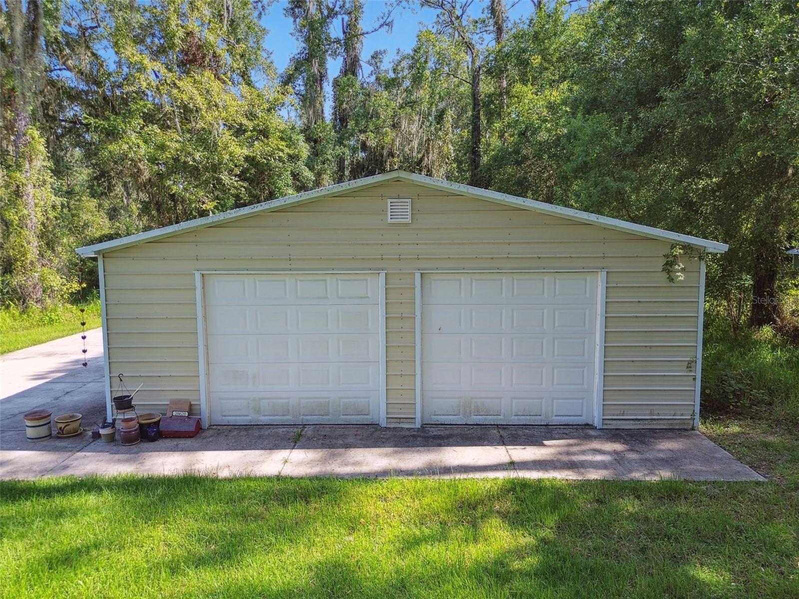 Insulated metal building with 2 garage doors